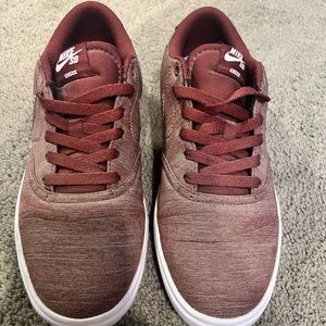 Nike burgundy skate shoe.